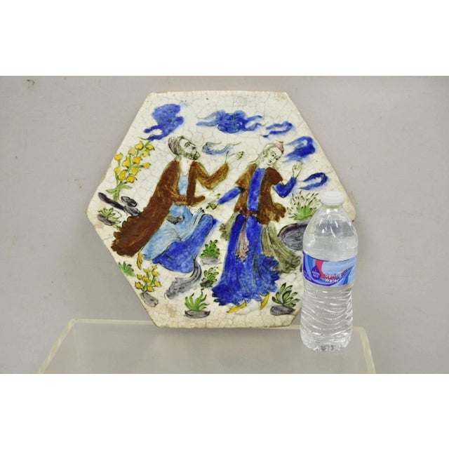 Antique Persian Iznik Qajar Style Ceramic Pottery Tile Hexagonal Blue Couple (C5). Circa Early 20th Century. Measurements...