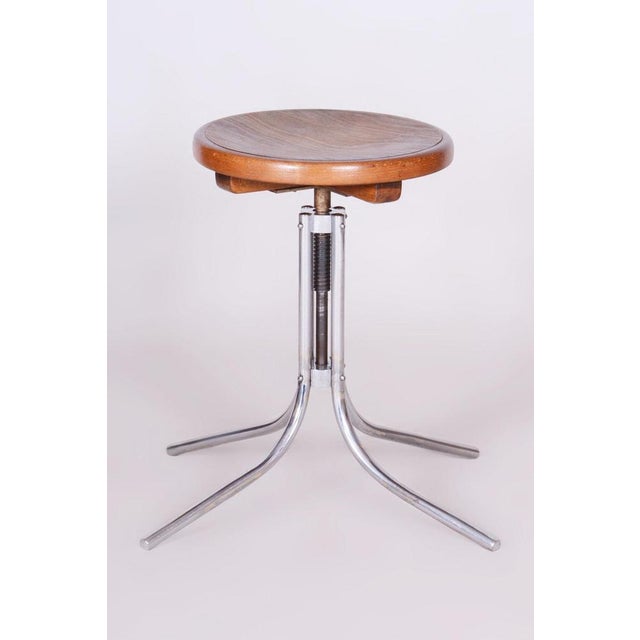 Minimum height: 56 cm (22 in) Maximum height: 67.5 cm (26.6 in) Diameter: 66.5 cm (26.2 in) This piano stool is an...