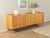 Classic sideboard from the 1950s. Cherry veneer body with two cabinet doors, one shelf, four drawers, and new stainless...