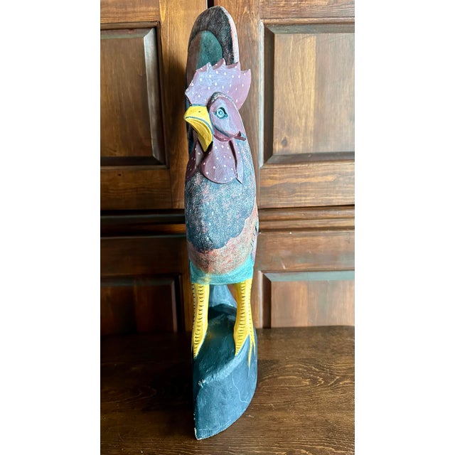 Rustic hand-carved and hand-painted large solid wood rooster folk art figure. Colors are include turquoise, shades of red,...