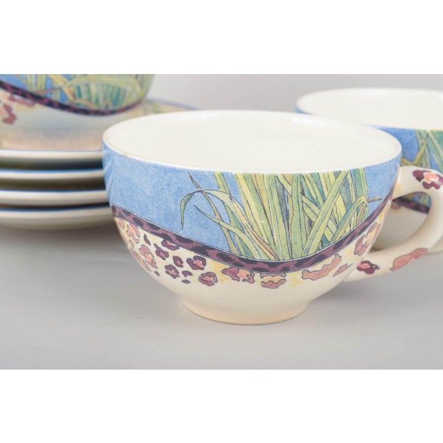 Gien "Savane", set of four large morning cups with matching saucers. Set of four large faience morning cups with matching...