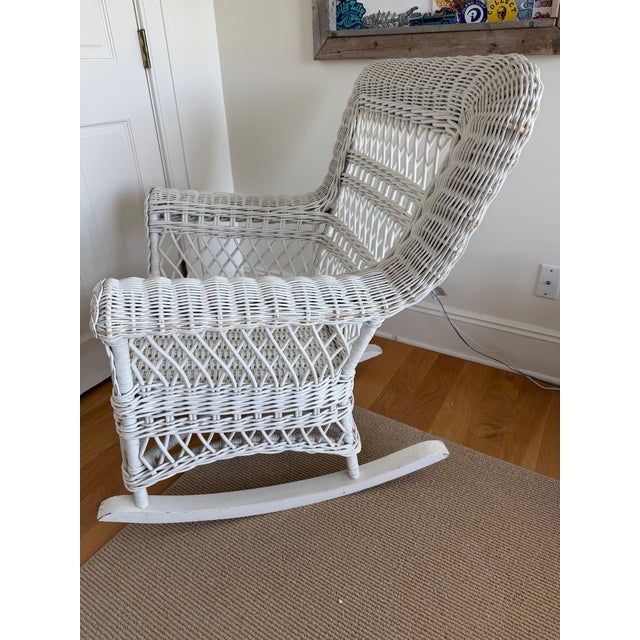 This white wicker rocking chair was purchased in Manhattan on Lexington Ave in early 1990s. Has been well taken care of....