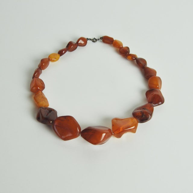 Danish Art Deco honey amber bead necklace with a silver ring bolt clasp. The beautiful amber beads are graduated from 1.4...