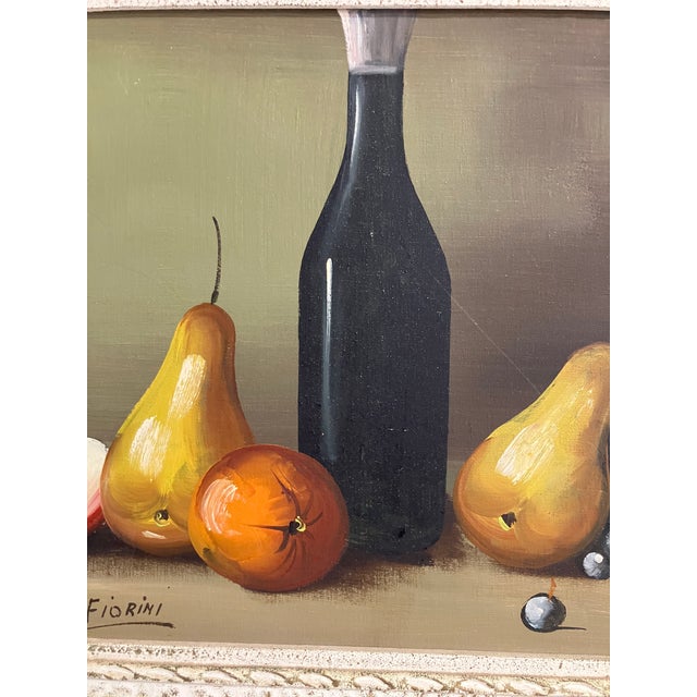 This listing is for a vintage still life painting signed Fiorini, featuring a classic arrangement of pears, apple, grapes,...