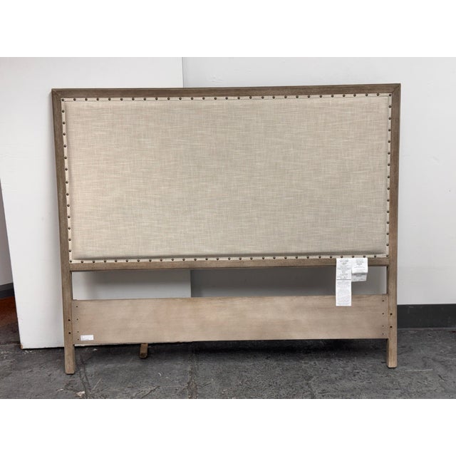 Design Plus Gallery presents a Queen Size Toulouse Wood + Fabric Headboard by Pottery Barn. The headboard has a fabric...