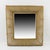 This elegant 1950s rectangular gilt metal wall-mounted mirror features stunning dimensional domed sides with raised...