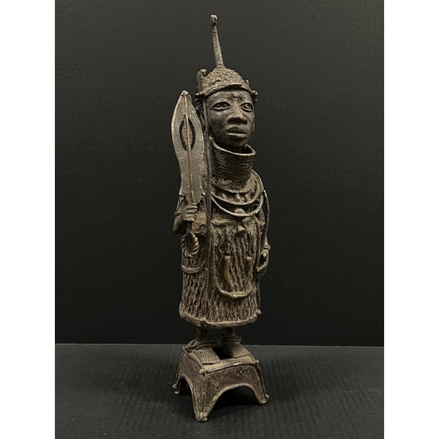 ITEM NAME: African Tribal Art Benin Bronze Warrior Sculpture ORIGIN: Nigeria AGES: Late 20th Century MATERIALS: Bronze...