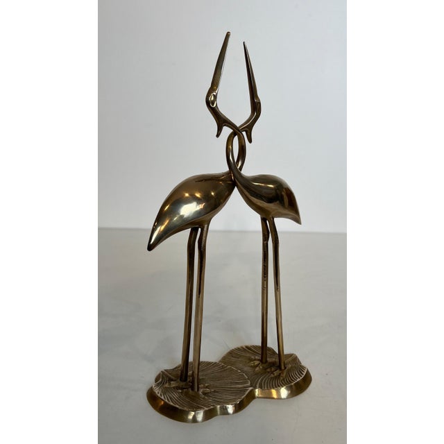 This beautiful sculpture of two entwined birds is made of brass. It is a French work. Circa 1970