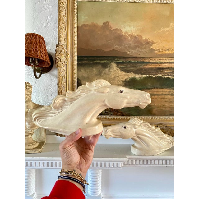 Wonderful pair of hollow porcelain horse / stallion heads, decorative. Would look beautiful displayed flanking a mantel,...