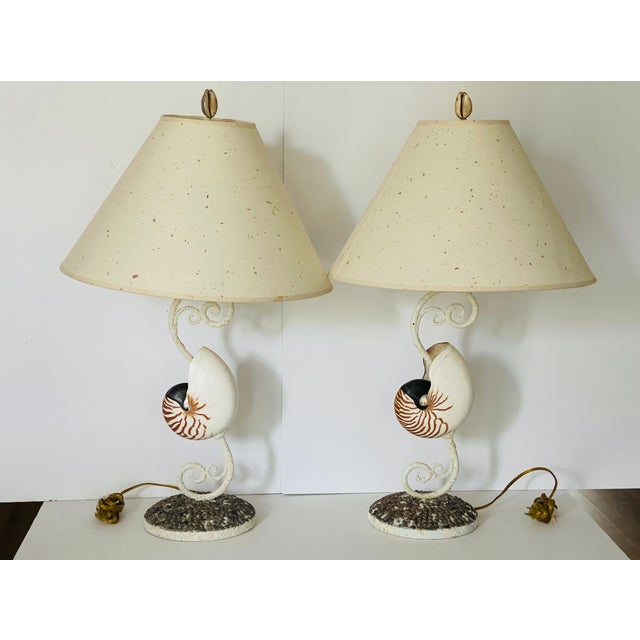 Mid century vintage pair of sea shell lamps with original paper shades. Great period decor.