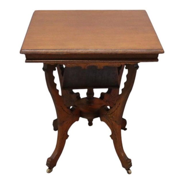 An antique oak table, attributed to RJ Horner, featuring distinctive chip-carved decoration. This piece showcases the...
