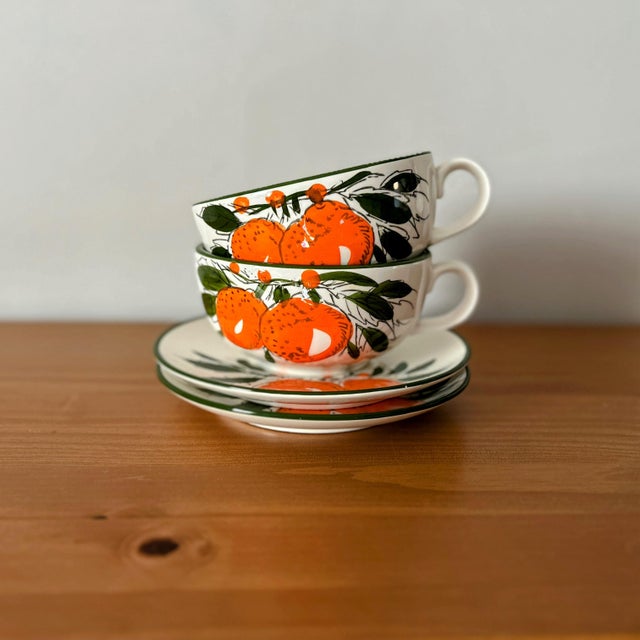 This vintage pair of oversized mugs and saucers are so fun and unique. Handpainted in Japan with orange fruits and leaves,...