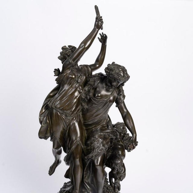 A large bronze sculpture on a marble base, signed by clodion, 19th century, napoleon iii period. Bronze sculpture with a...