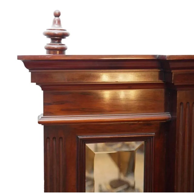 An antique Italian vanity composed of palisander rosewood. Features two lower key entree cabinets followed by a large...