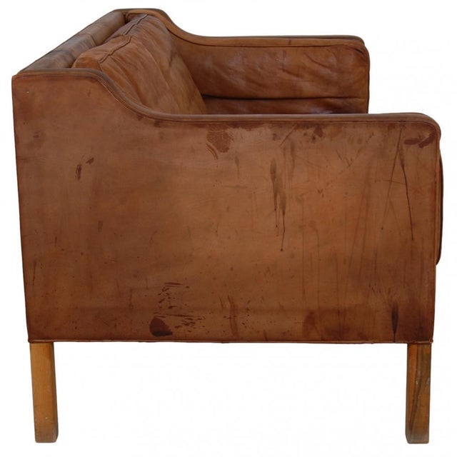 Børge Mogensen 2. seater sofa model 2212, upholstered with the original aniline leather, and with legs of mahogany. The...