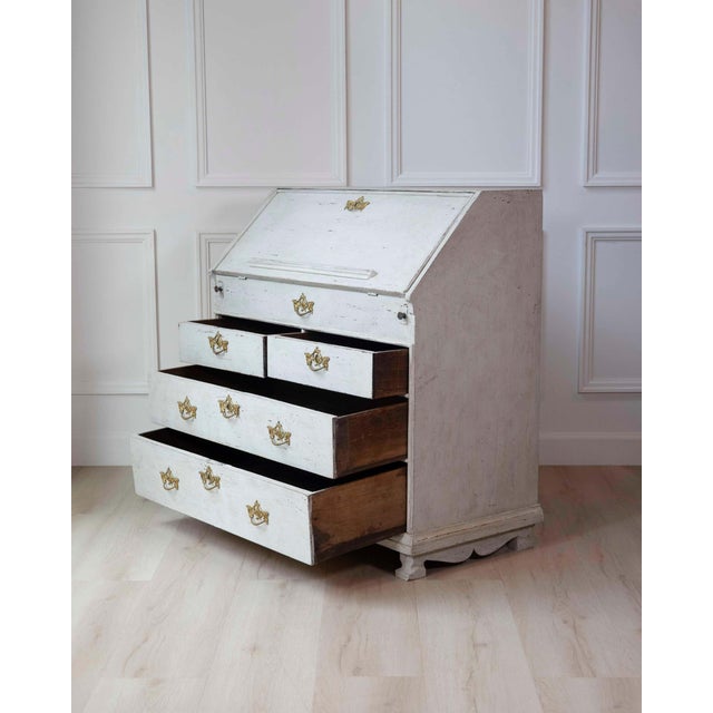 A refined Scandinavian bureau dating to circa 1790, crafted in pine with a beautifully aged painted finish that reflects...