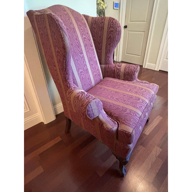 This classic Ethan Allen Queen Anne Style Wingback Chair features a stately silhouette that blends traditional American...