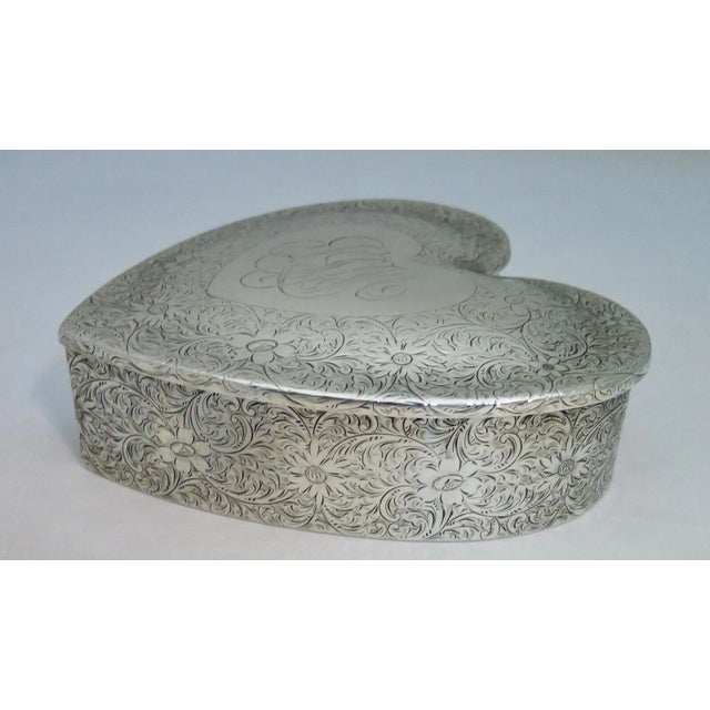 This vintage rare sterling silver heart shape Valentine jewel box dates from the early 20th century. The sterling jewel...