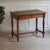 An elegant, unique piece with authentic character: This antique desk/console table from around 1890 impresses with its...
