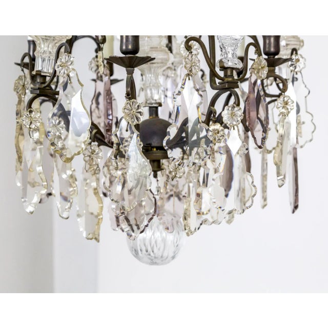 A Belle Epoque period, blackened bronze, birdcage chandelier with maximum, heavy crystals in clear and subtle, smoky...