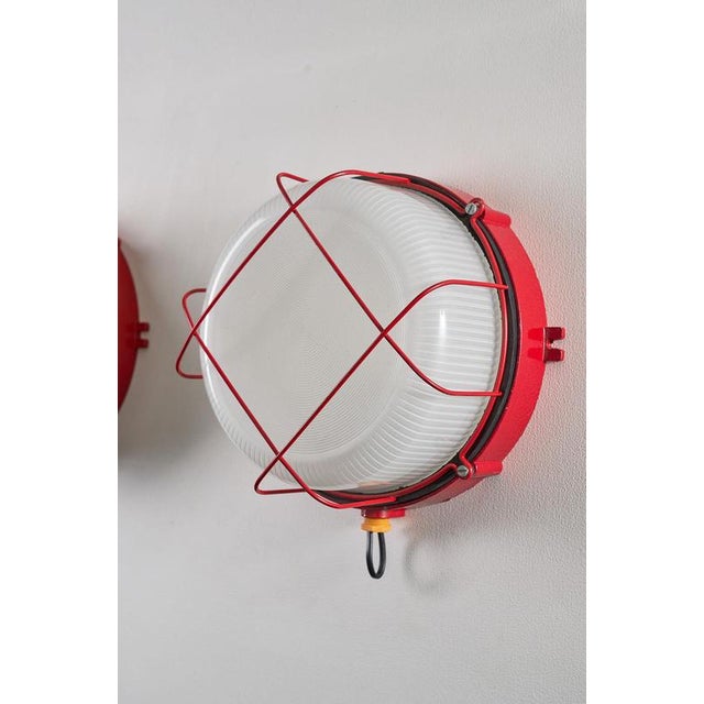 Robust flush mount lamp from the 1970s, combines industrial utility with a splash of vintage Pop Art color. Designed as a...