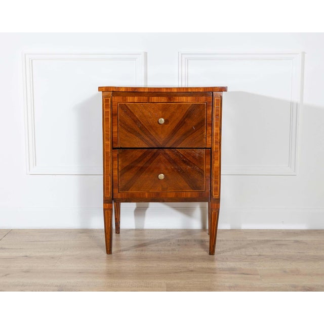 A graceful 19th-century Italian bedside cabinet in the Louis XVI style, finely crafted in walnut and embellished with...