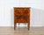 A graceful 19th-century Italian bedside cabinet in the Louis XVI style, finely crafted in walnut and embellished with...