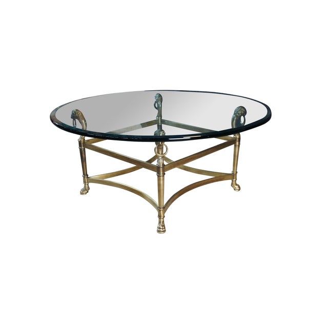 A exceptional late 20th century Italian Regency style Coffee Table. Features a round polished and beveled glass top over a...