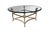 A exceptional late 20th century Italian Regency style Coffee Table. Features a round polished and beveled glass top over a...