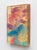Whelming Over features a figure enveloped in vibrant hues of pink and teal, surrounded by abstract, gestural hands that...