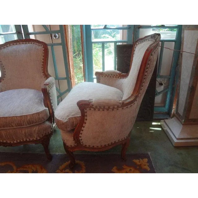 Stylish and comfortable best describe this beautiful pair of antique Italian chairs. This pair of Italian bergères have...