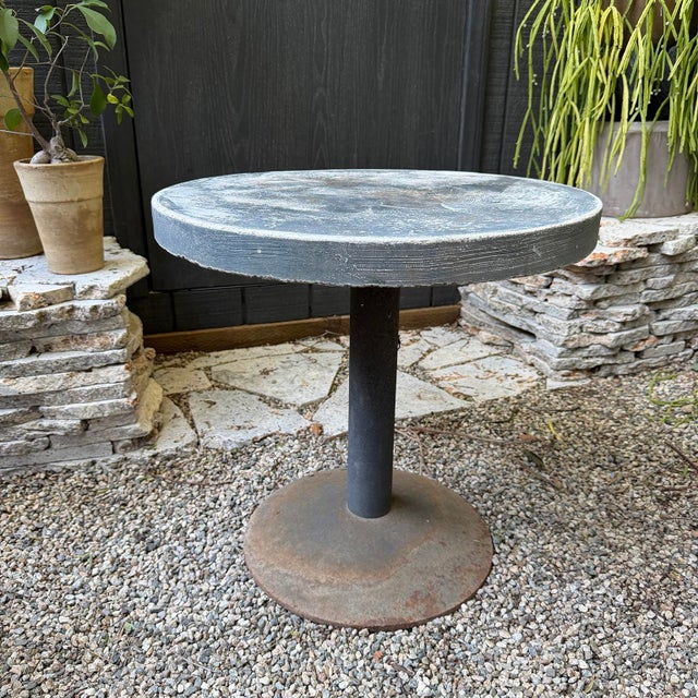 20th century brutalist side table with concrete top and steel base. Suitable for outdoor use.
