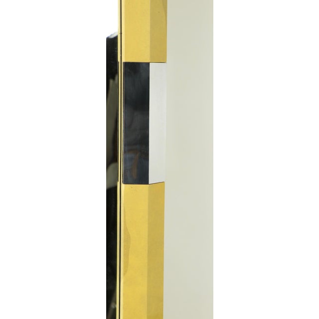Large 1970s-1980s lacquered parchment and bright chrome framed plate glass mirror. This example is of the highest quality...