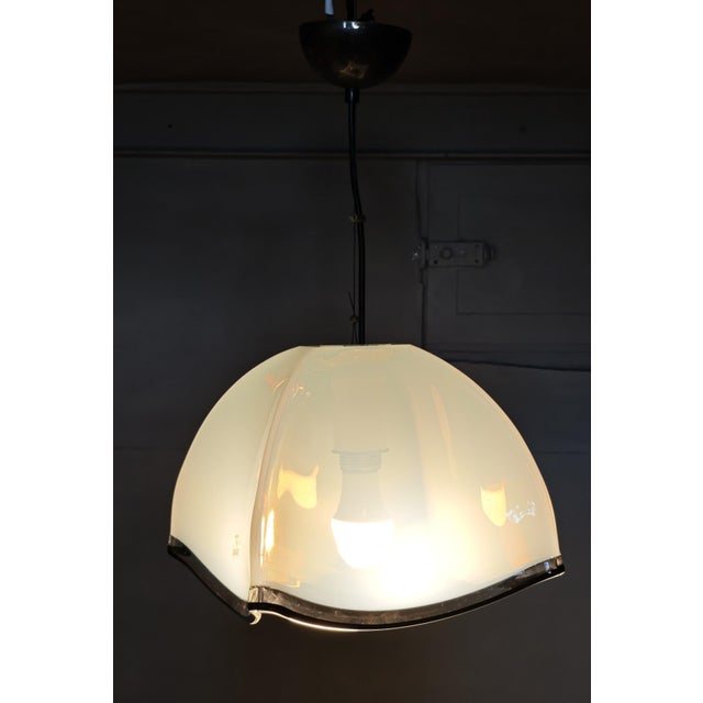 This set includes a pendant lamp and a wall lamp dating back to the 1980s and 1990s, made with Murano glass diffusers...