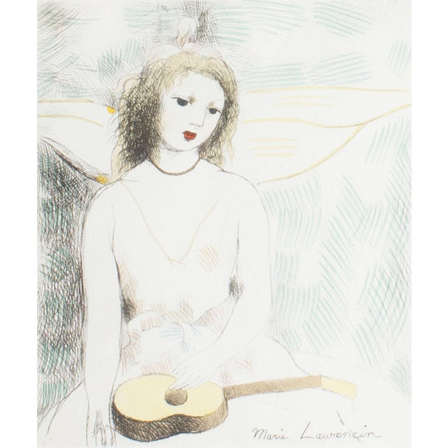 A hand-colored etching by the French artist Marie Laurencin (1883-1956). Titled "Jeune fille à la guitare (Young Girl with...