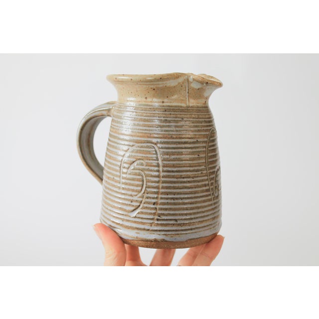 Vintage studio art pottery water pitcher. Signed and dated by artist on bottom. No chips or cracks.
