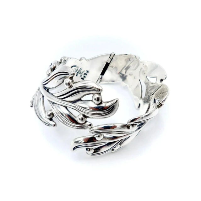 This is part of Chairish’s Costume Jewelry assortment. A beautiful sterling silver hinged clamper bracelet by Margot De...