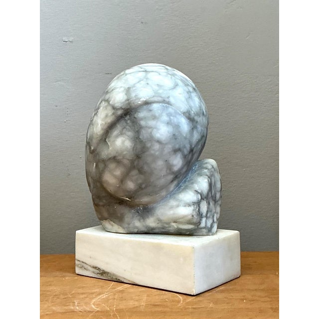 This vintage abstract marble sculpture is a striking example of Mid-Century Modern design, where organic form and natural...