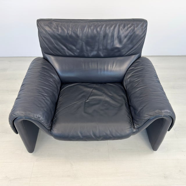 Dimensions: H 32” x W 43” x D 31” x SH 16” Vintage armchair DS 2011 from De Sede, upholstered in original dark blue...
