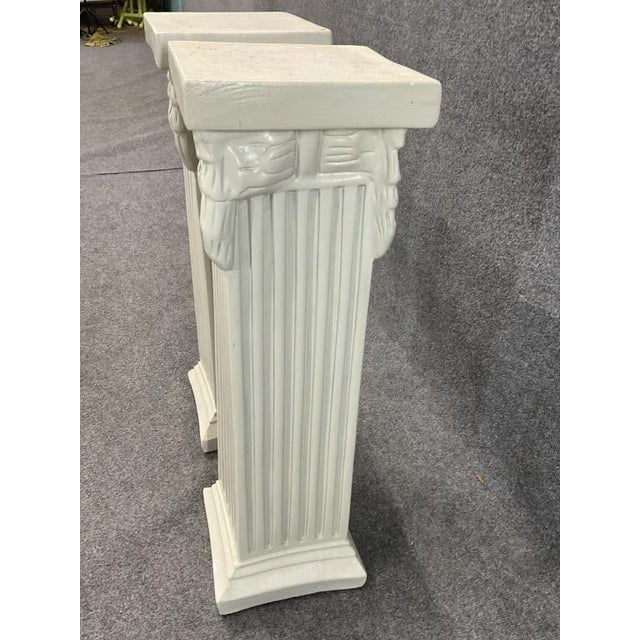 Antique Neoclassical Ionic Pedestals – Early to Mid-20th Century (likely 1910s to 1930s) Step back into the era of the...
