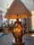 Vintage pair of Anthony California lamps with an oakwood frame and smoked etched glass panels surrounding a unique...