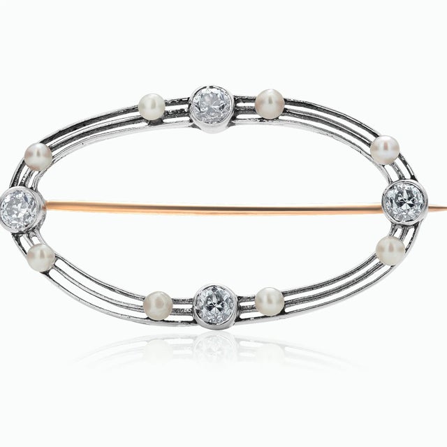 This is part of Chairish’s Fine Jewelry assortment. The Art Deco Platinum Diamond and Natural Pearl Brooch is a stunning...