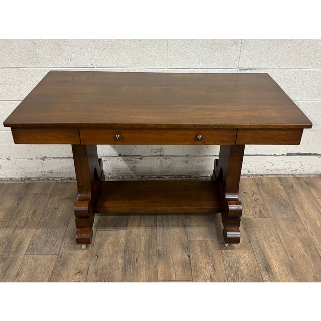 This is an absolutely stunning antique American Empire style library table, server, or desk with harp or lyre shaped...