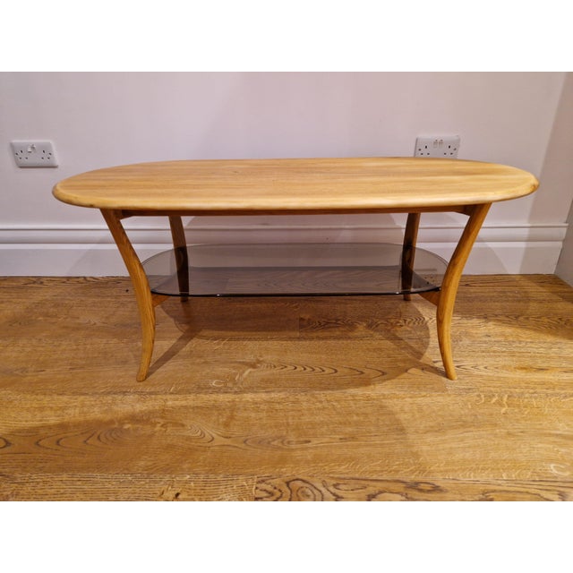 Mid-Century Modern Mid-Century Blonde Oval Coffee Table Smoked Glass from Ercol, 1970s For Sale - Image 3 of 11