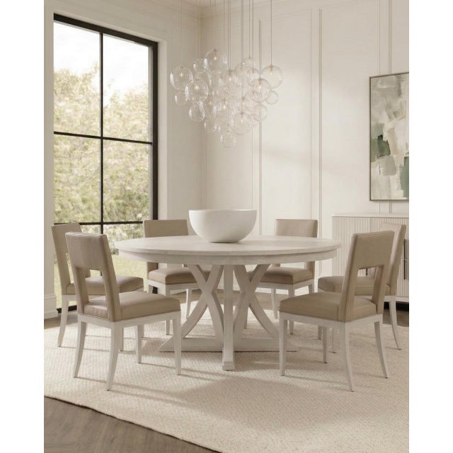 A rectangular opening through each back serves as a handhold and gives the otherwise spare outline a distinctive detail....