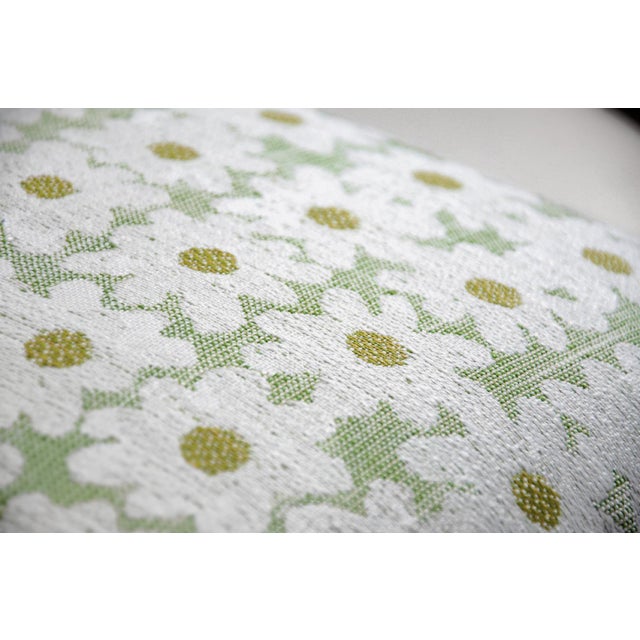 A soft whisper of botanical grace rendered in gentle, muted tones—this 22-inch pillow captures the delicate silhouette of...
