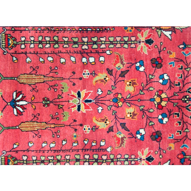 A wonderful early 20th century Persian Sarouk Farahan rug with a traditional central tree-of-life motif flanked by pairs...