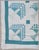 This summer-weight cotton quilt is in shades of green on an off-white ground. It was discovered at an estate in New...