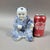 Very nicely hand painted porcelain seated Chinese boy holding a lingzhi fugus, traditional symbol of longevity, in his...