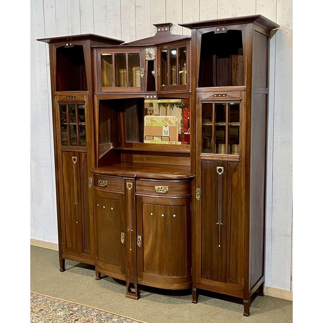 Mahogany sideboard with clock, Belgian work from the Art Nouveau period in the style of Gustave Serrurier Bovy (1858-1910)...